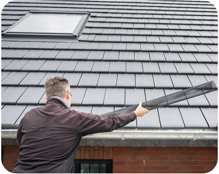 Roof restoration specialist working on a tile roof in Sydney